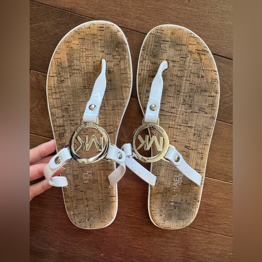 Michael Kors white sandals size 7 silver emblem cork bottom